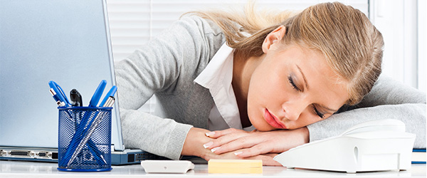 Tired business woman sleeping at work